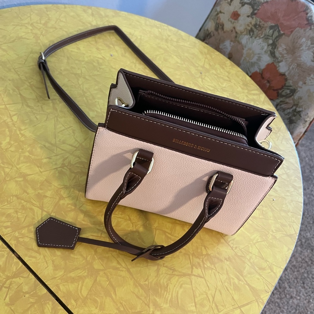 Cute little shoulder purse. Fits small wallet and phone plus more!